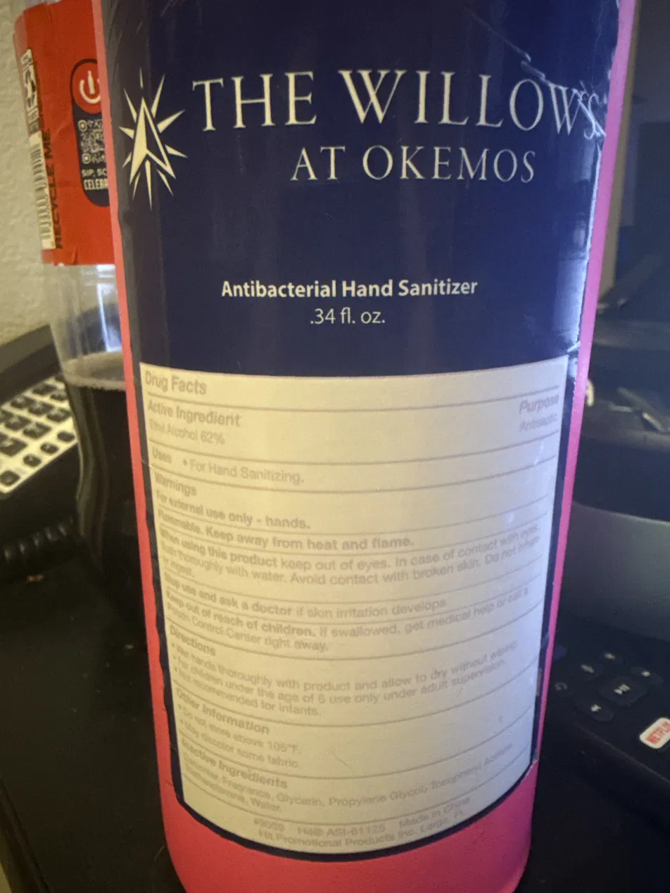 Promotional hand sanitizer bottle with small-print label
